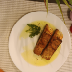Grilled fish in lemon butter sauce